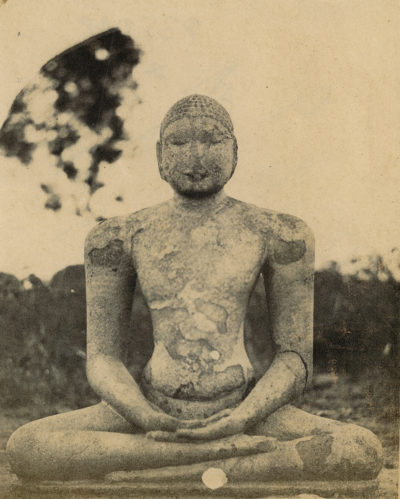 [Photo.35/(048)] Sitting stone figure (Buddha ?)