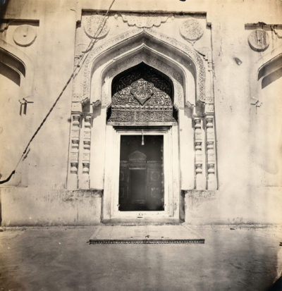 [Photo.35/(056)] Doorway with ornate arch featuring writing in Arabic script
