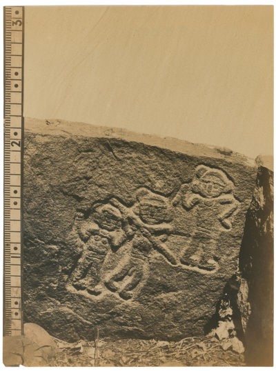 [Photo.35/(067)] Stone fragment featuring carved human figures