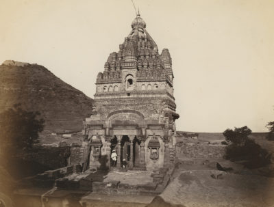 [Photo.35/(068)] View of a temple building with two Indian men in front